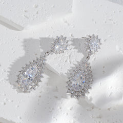 Celeste Halo Pear Drop Earrings — Sparkling CZ Teardrops in Silver-Tone Setting