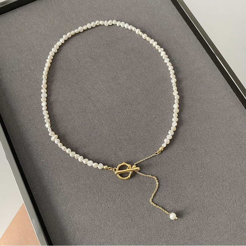 Elegant Irregular Freshwater Pearl Necklace with Sculptural OT Clasp