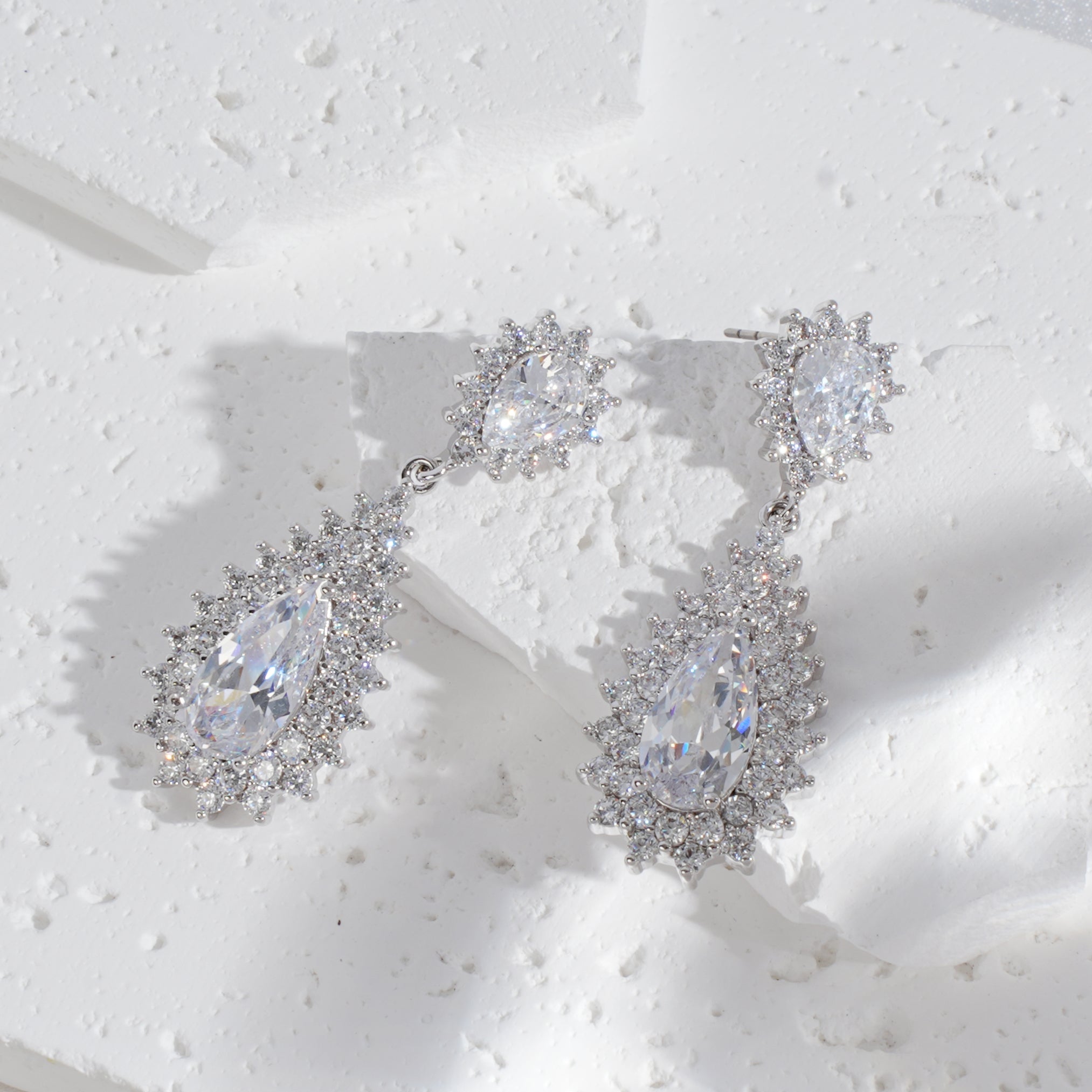 Celeste Halo Pear Drop Earrings — Sparkling CZ Teardrops in Silver-Tone Setting